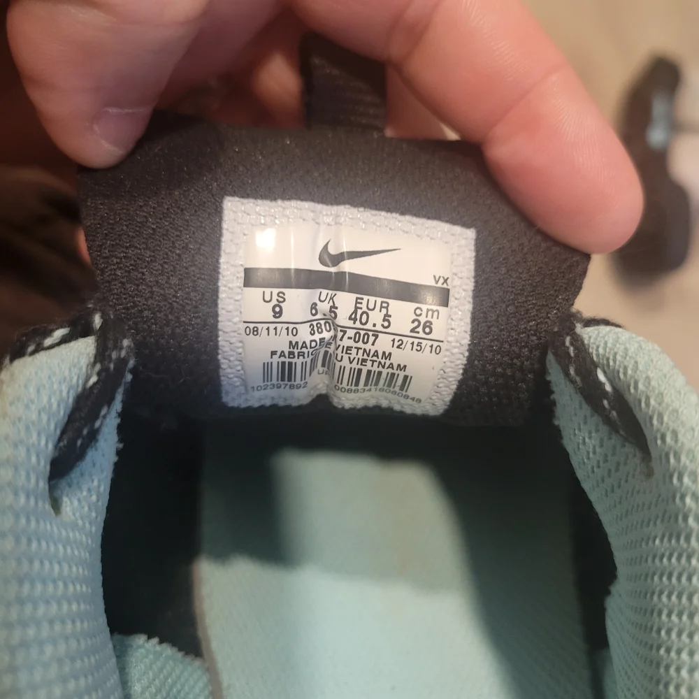 Nike Women's Beige and Black Athletic Shoes with Teal Accents - Picture 4 of 5